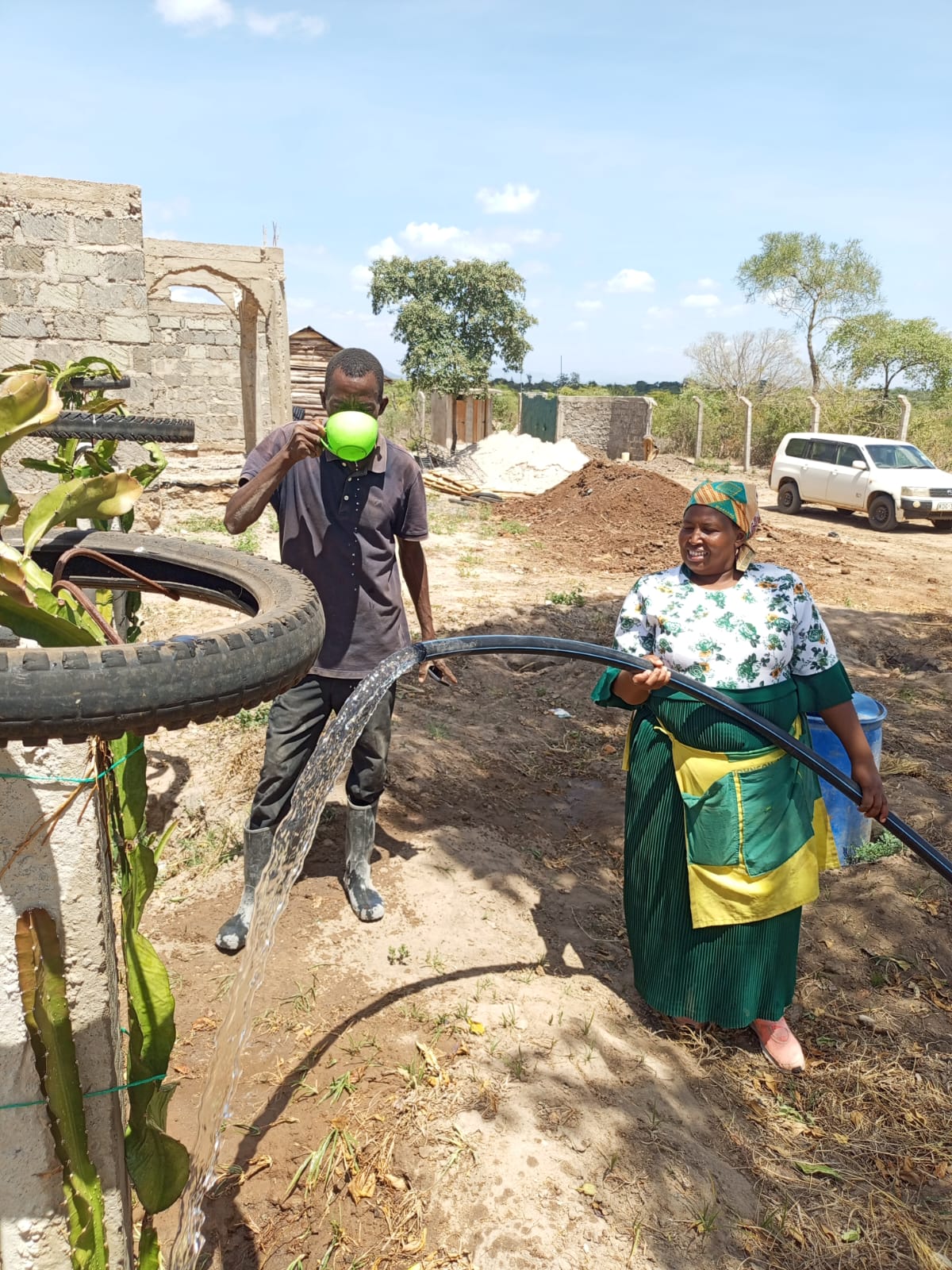 Community accessing clean water from borehole